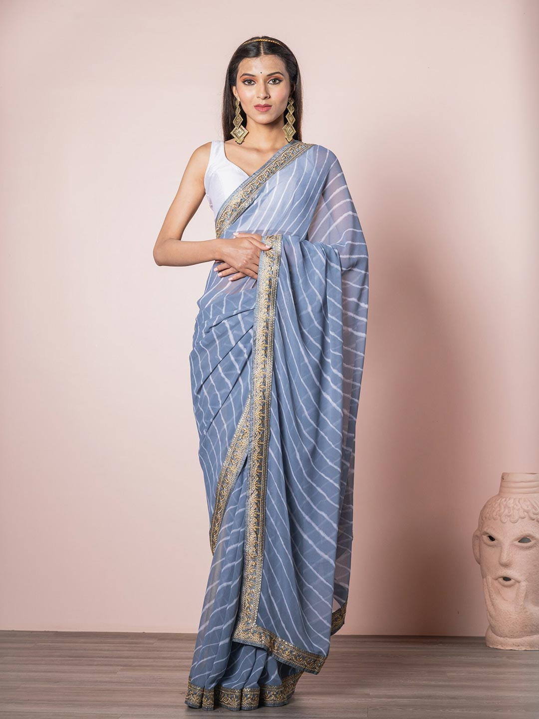 

Exclusiva Grey Georgette Leheriya Saree with Embroidered Border
