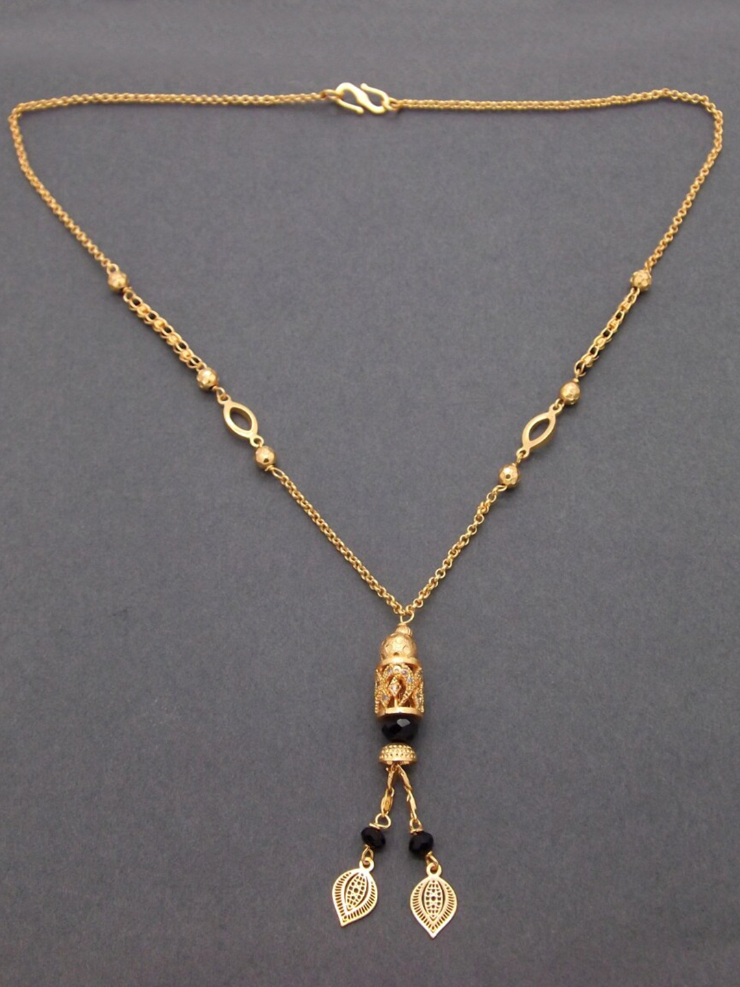 

FEMMIBELLA Women Gold-Plated Black Beaded AD-Studded Mangalsutra