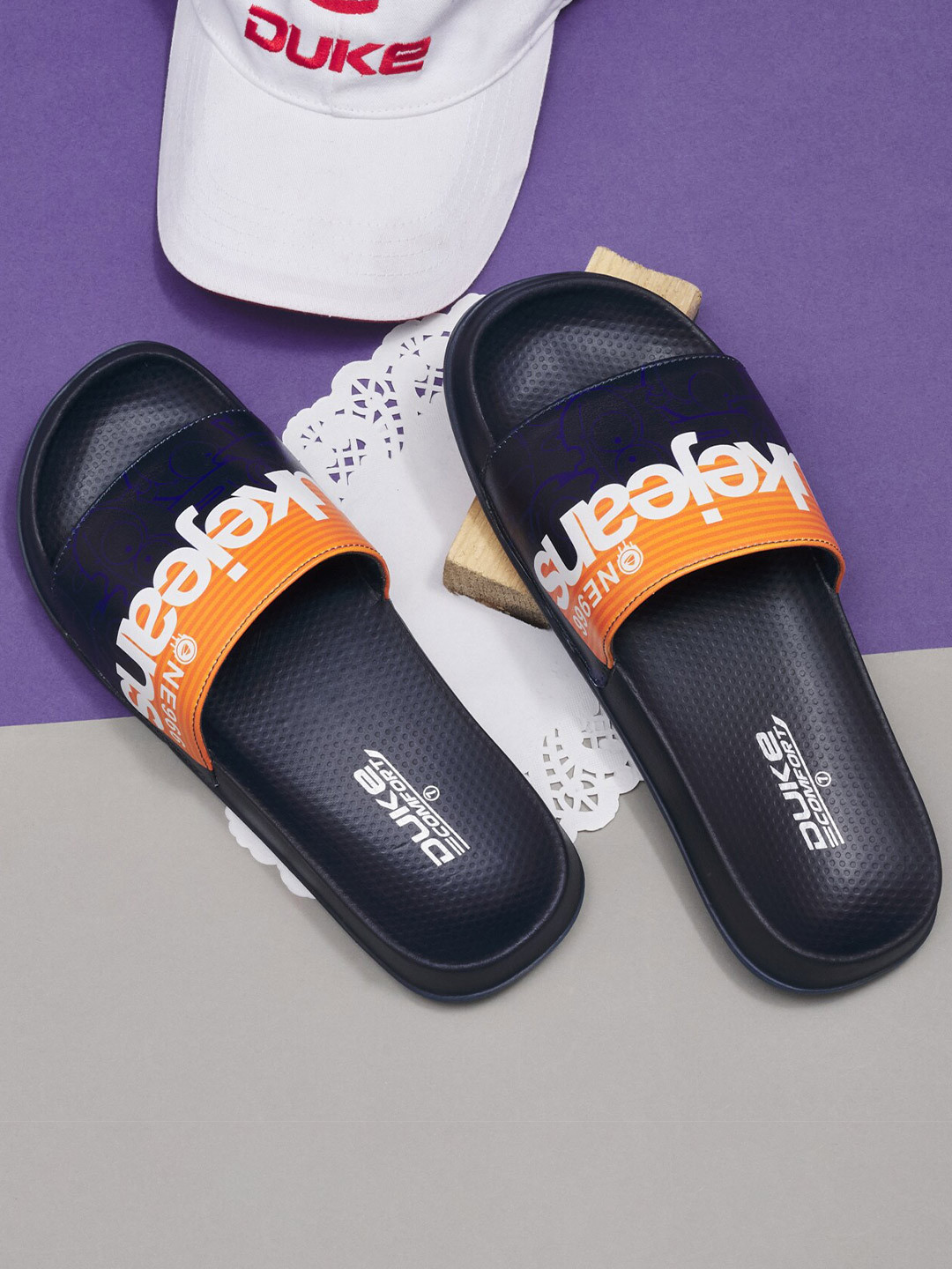 

Duke Men Navy Blue & Orange Printed Sliders