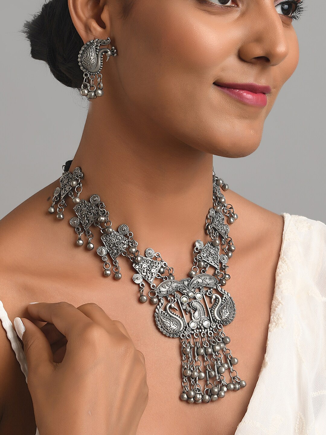 

Fida Oxidised Silver-Plated Ghungroo Beads Studded Jewellery Set