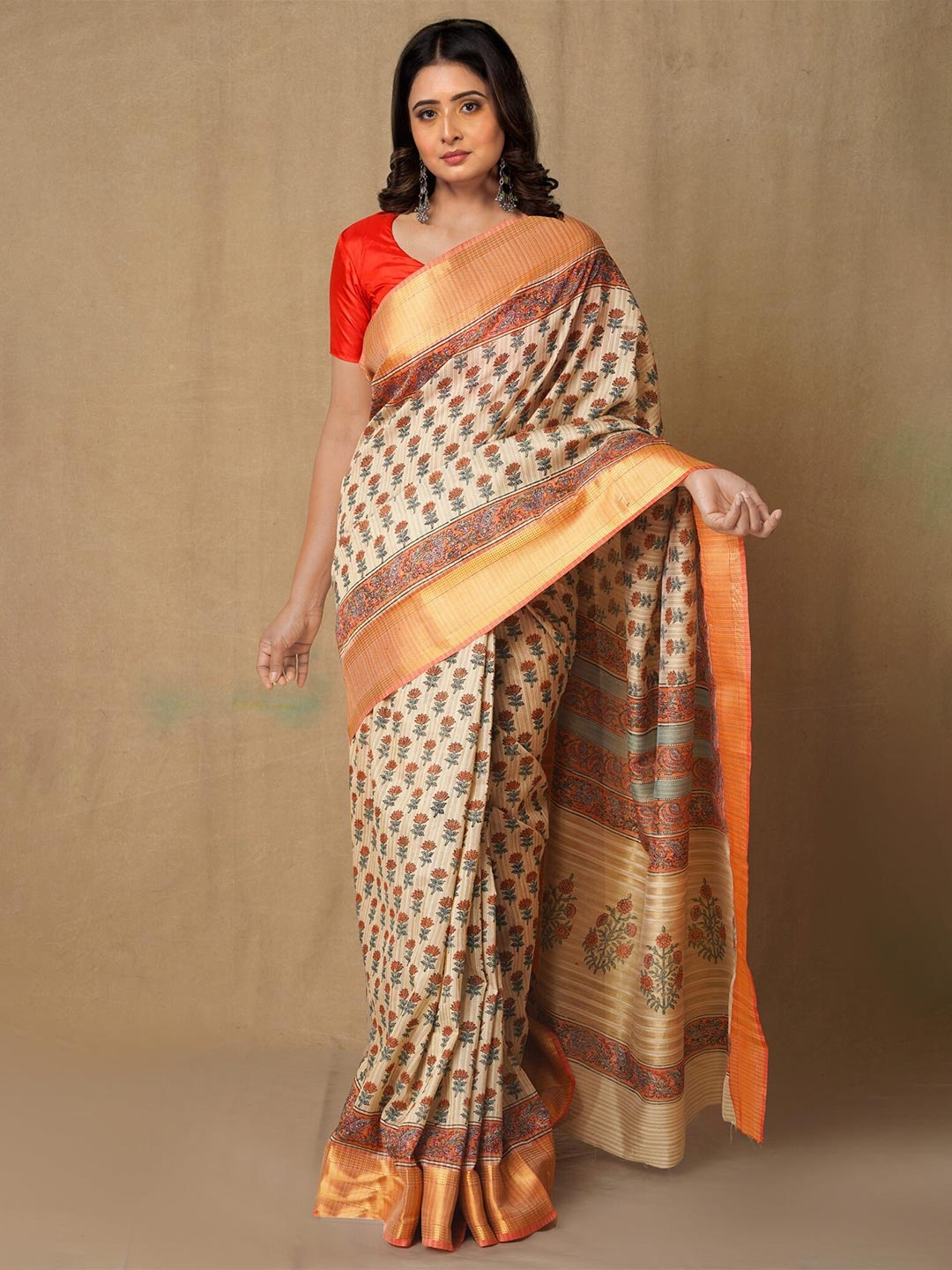 

Unnati Silks Brown & Orange Ethnic Motifs Zari Silk Blend Tussar Saree