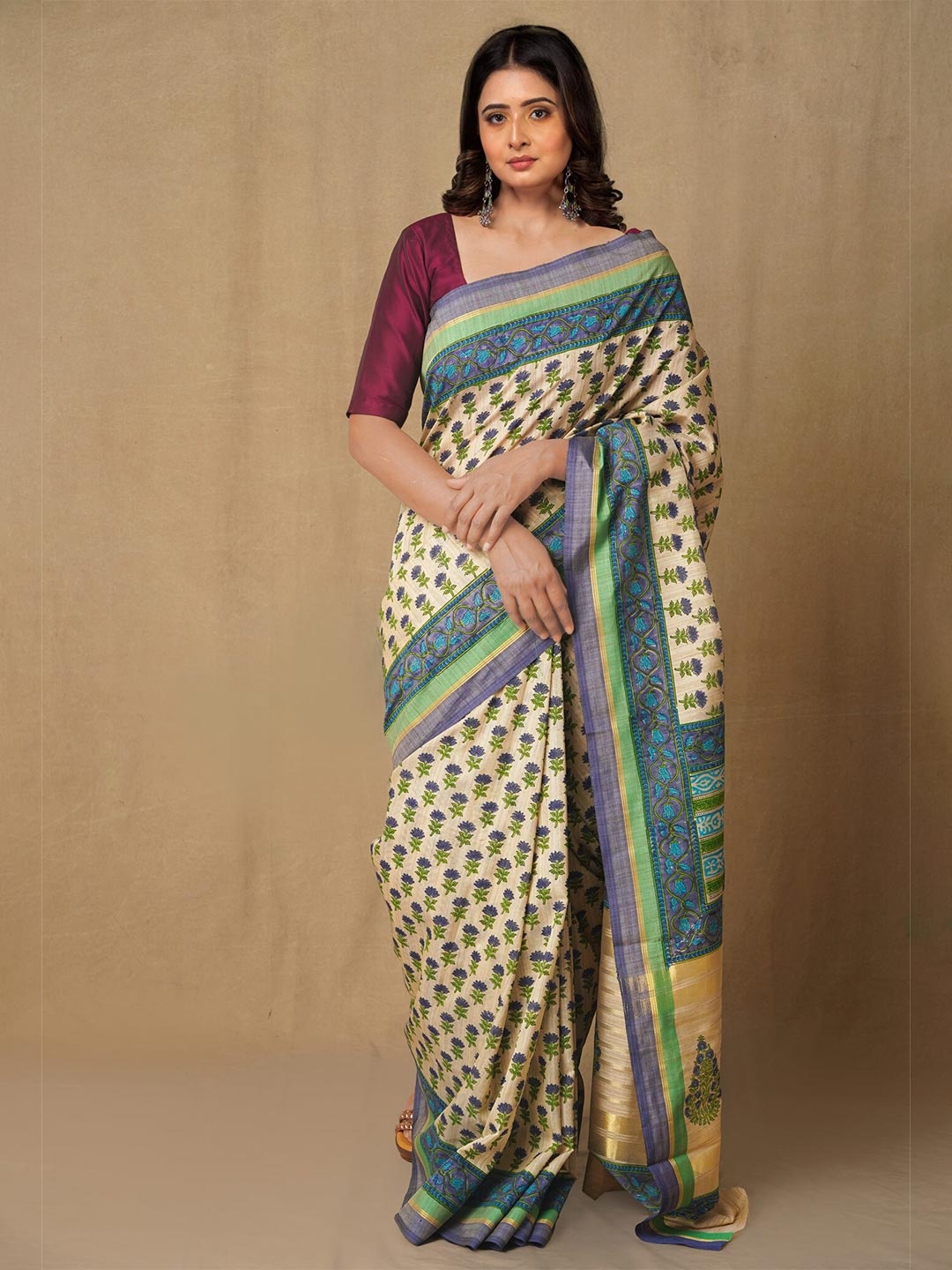 

Unnati Silks Brown & Green Ethnic Motifs Zari Silk Blend Tussar Saree