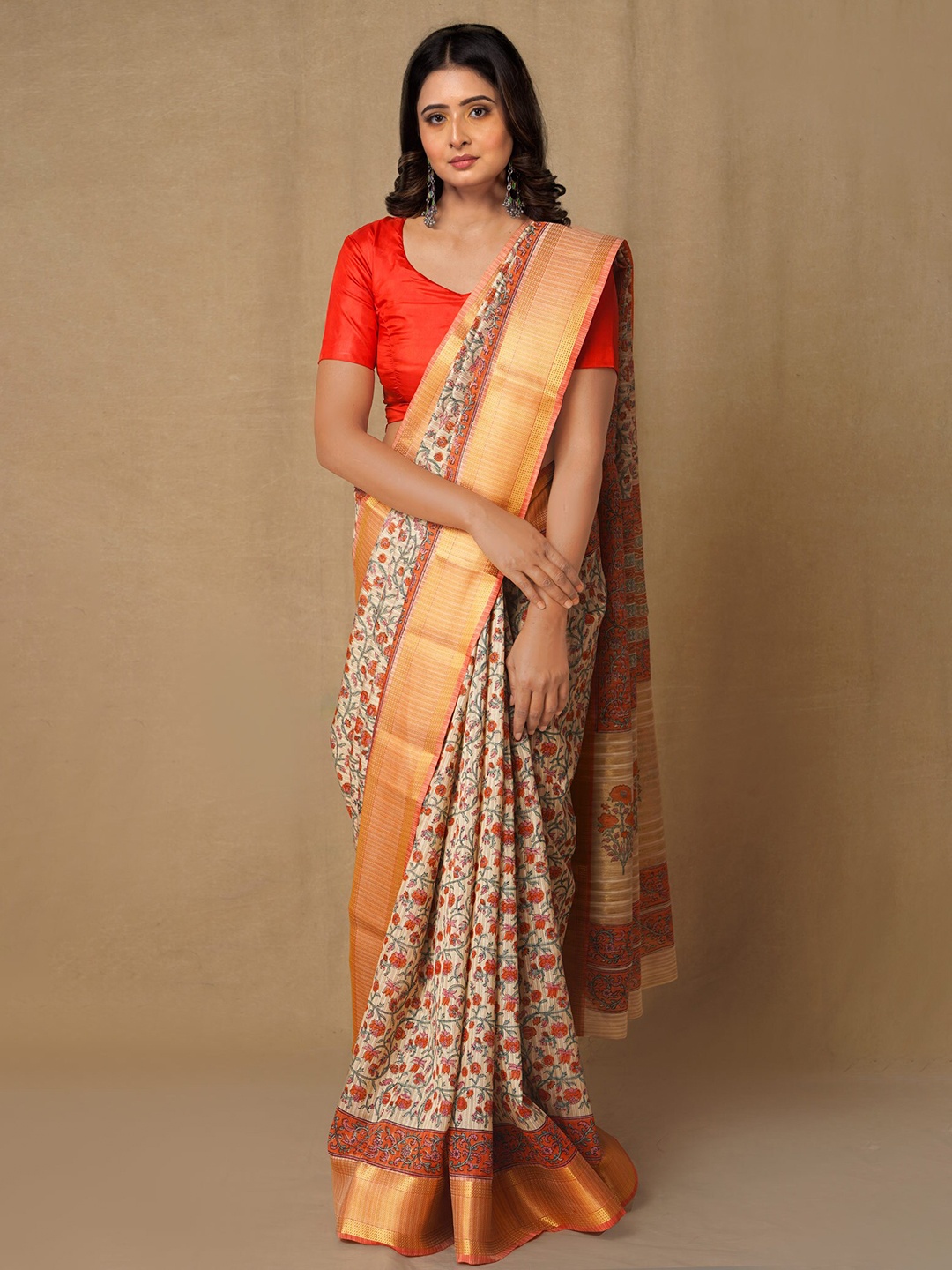 

Unnati Silks Brown & Green Ethnic Motifs Zari Silk Blend Tussar Saree