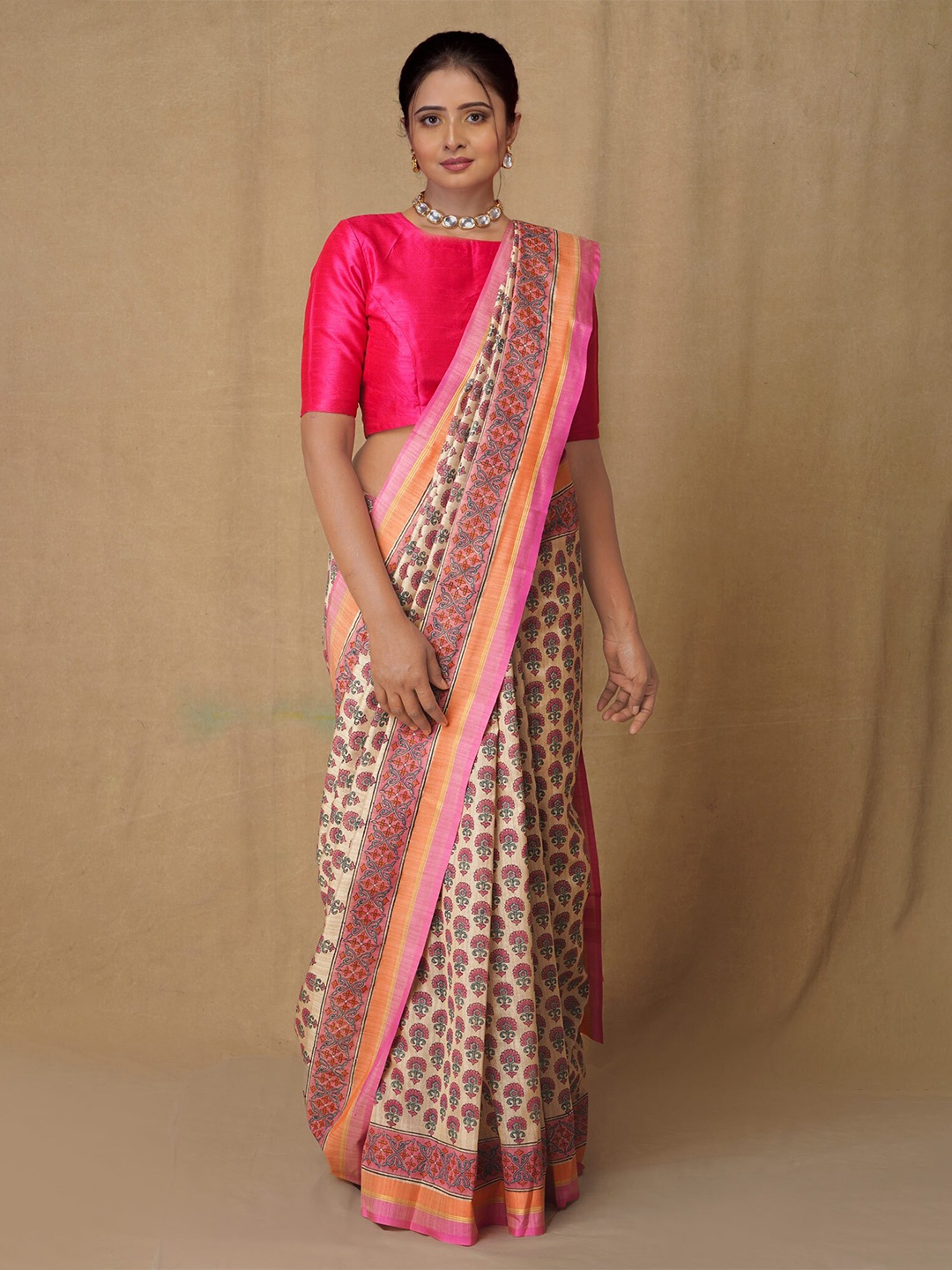 

Unnati Silks Cream & Brown Ethnic Motifs Silk Blend Tussar Saree