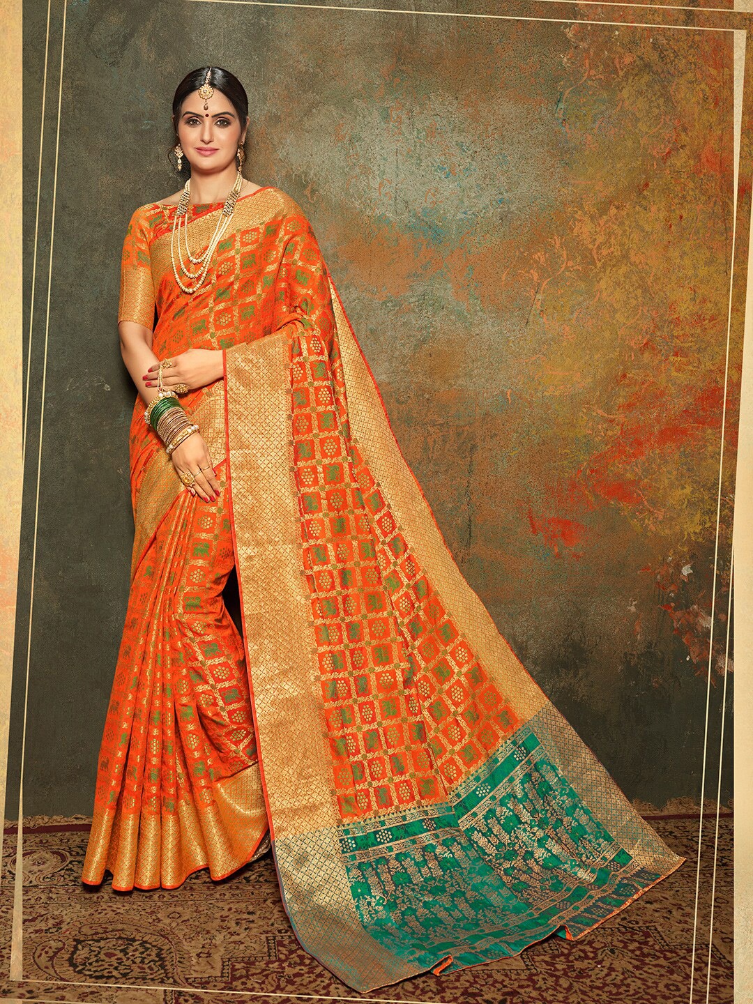 

Shaily Orange & Gold-Toned Woven Design Zari Silk Blend Patola Saree