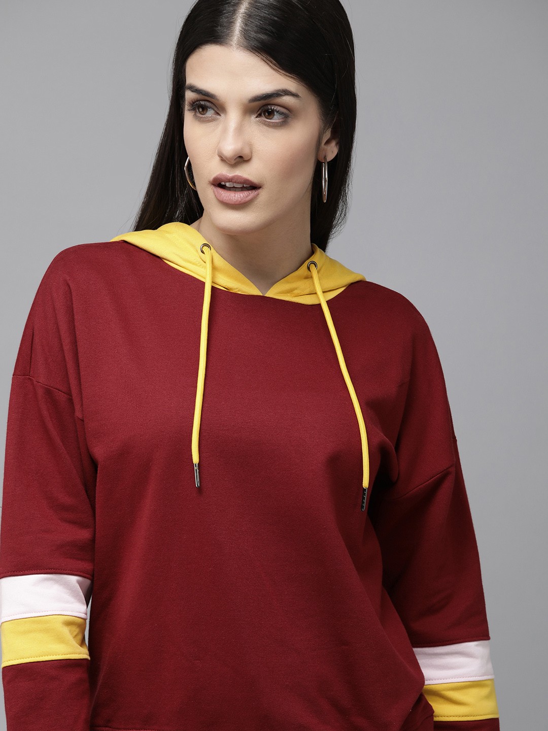 

Van Heusen Women Maroon And Yellow Colourblocked Hooded Sweatshirt