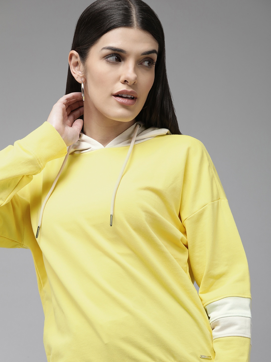 

Van Heusen Women Yellow Solid Hooded Pure Cotton Sweatshirt