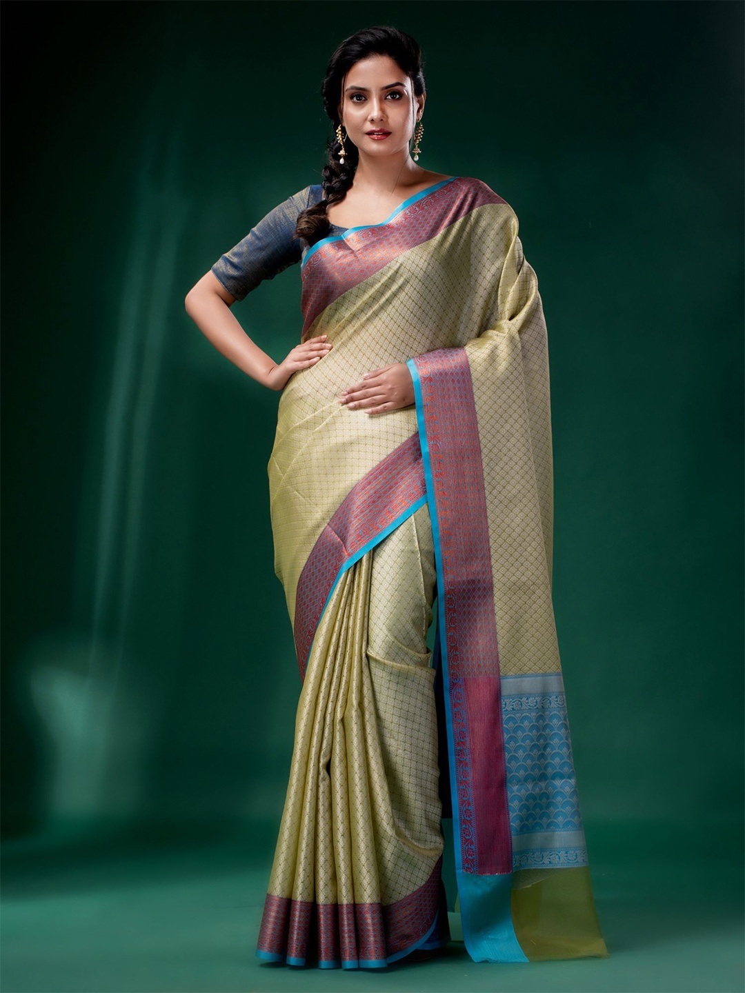 

Charukriti Women Cream & Gold-Toned Woven Design with texture design Zari Organza Saree