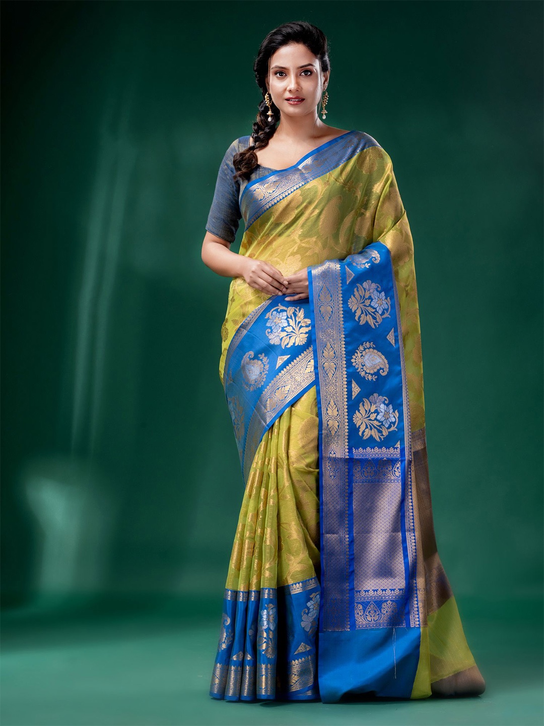 

Charukriti Green & Blue Woven Design Zari Organza Saree