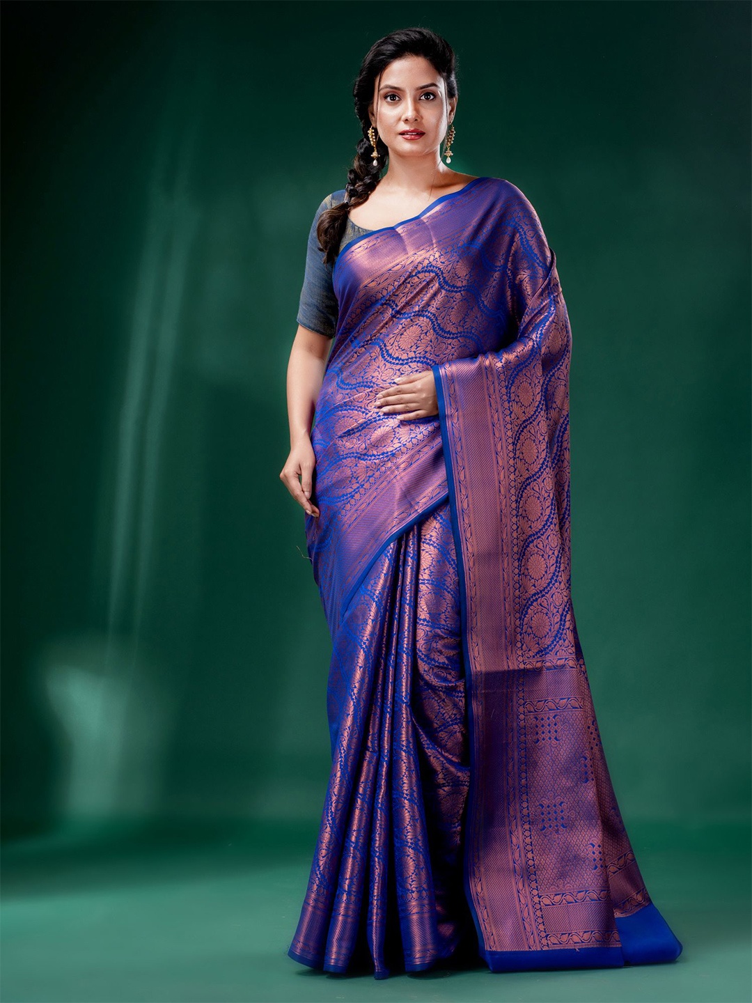 

Charukriti Blue & Gold-Toned Ethnic Motifs Zari Brocade Saree