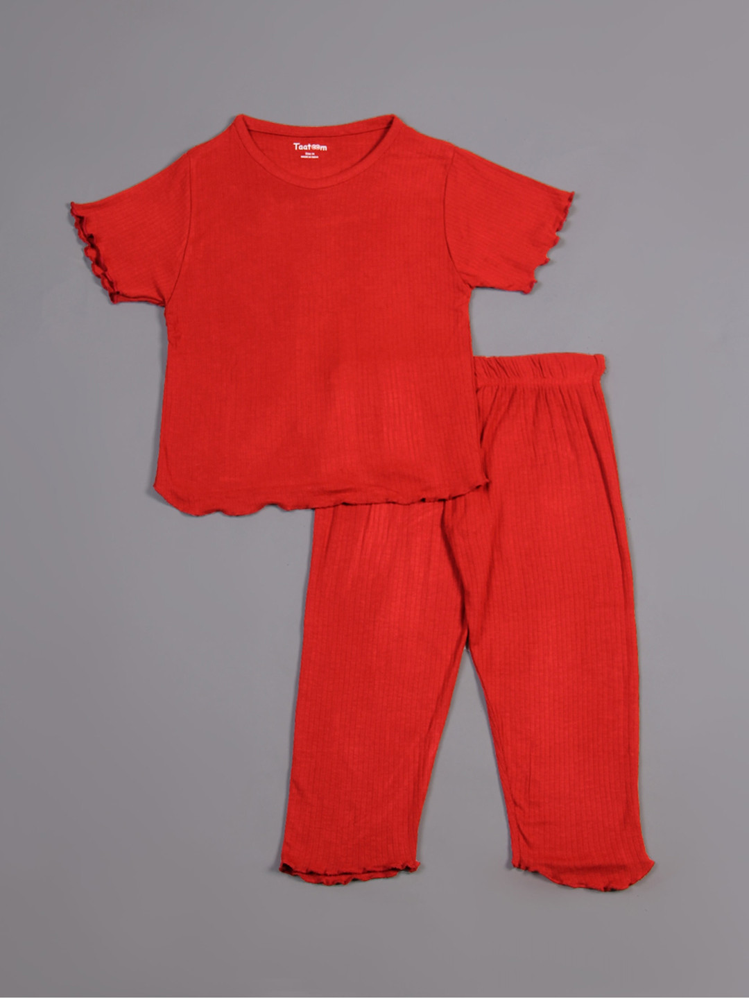 

Taatoom Girls Red Ribbed Self Design Night suit with Raw Edges