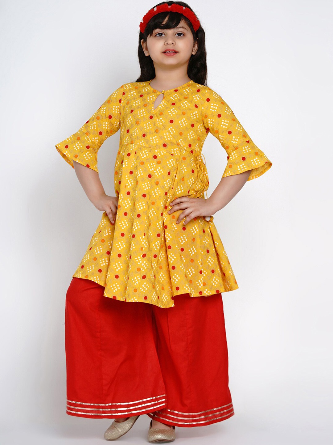 

Bitiya by Bhama Girls Yellow Ethnic Motifs Printed High Slit Pure Cotton Kurta with Skirt