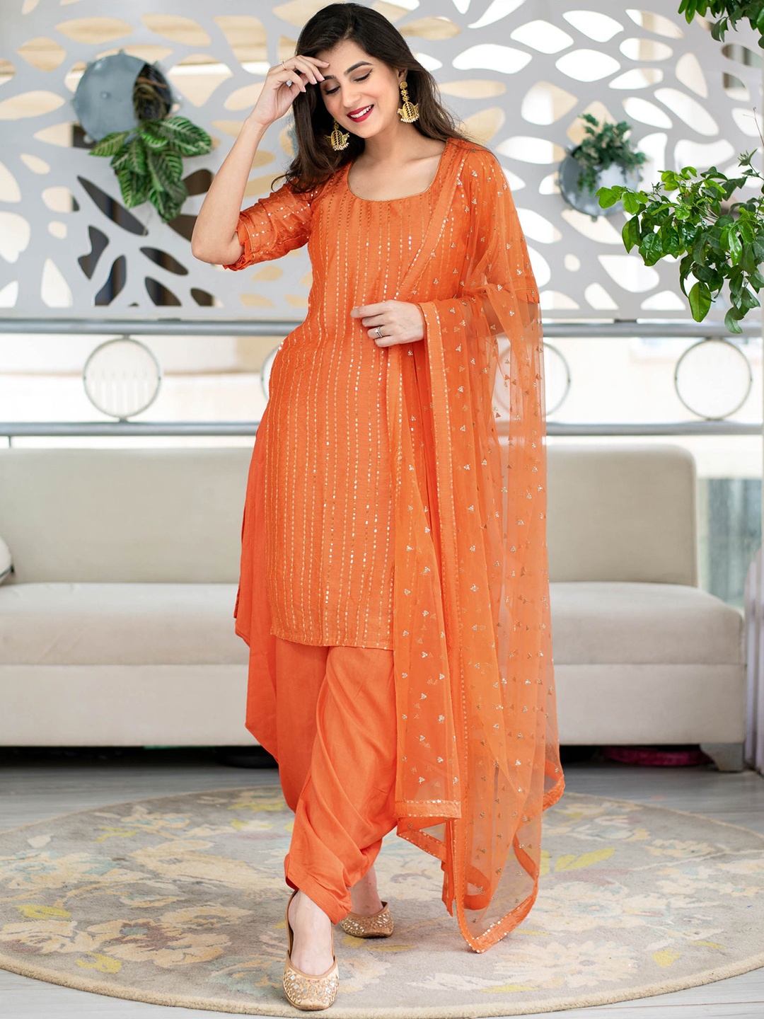 

Ethnic Yard Women Orange & Gold-Toned Sequinned Semi-Stitched Dress Material