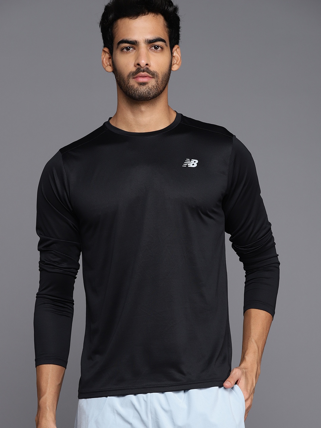 

New Balance Men Black Solid Sports T-shirt