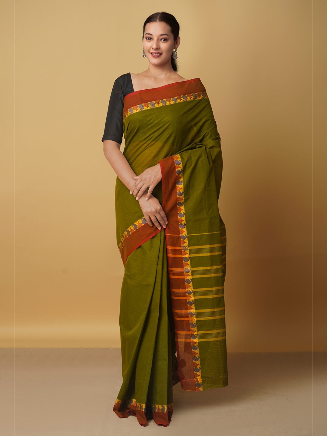 

Unnati Silks Green & Red Striped Pure Cotton Venkatgiri Saree