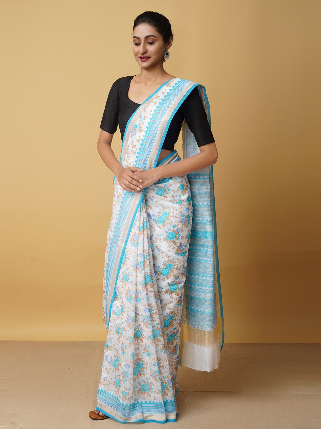 

Unnati Silks Blue & White Floral Silk Cotton Baluchari Saree