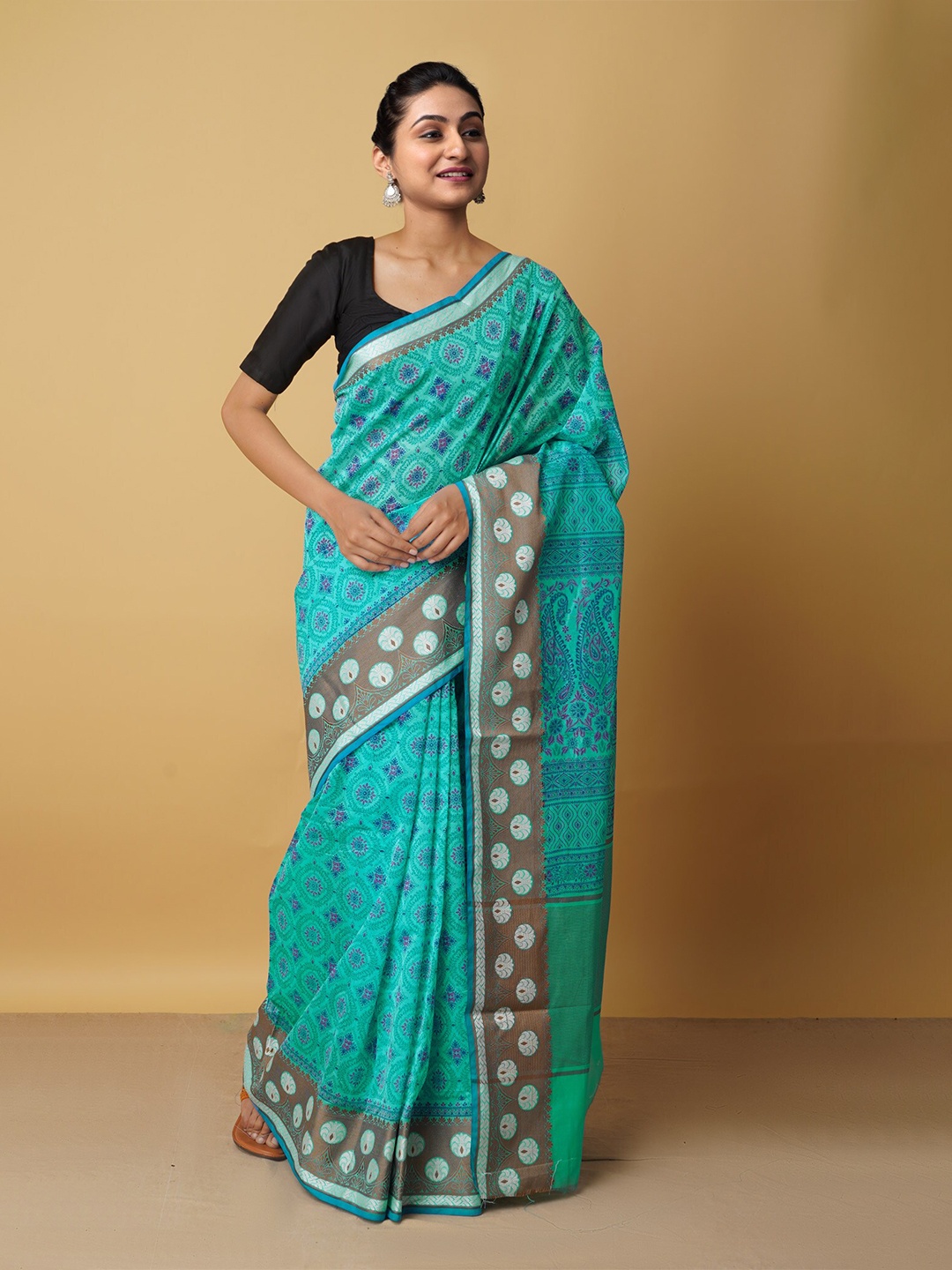 

Unnati Silks Green & Grey Ethnic Motifs Zari Silk Cotton Baluchari Saree