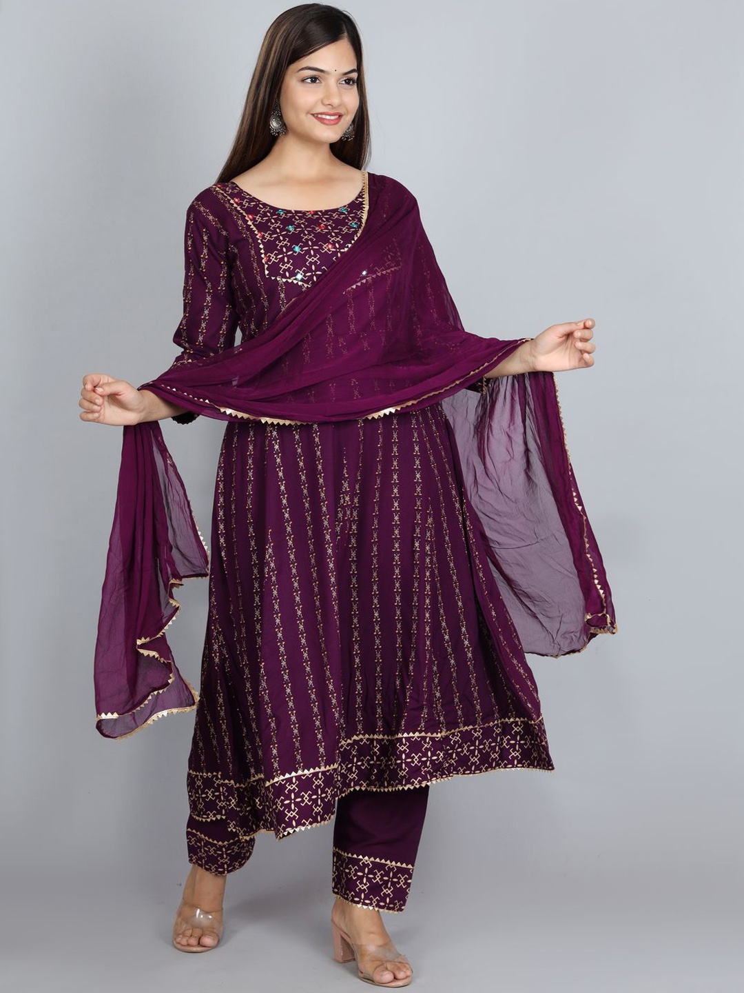 

Ziva Fashion Women Purple Yoke Design Layered Mirror Work Kurti with Trousers & With Dupatta