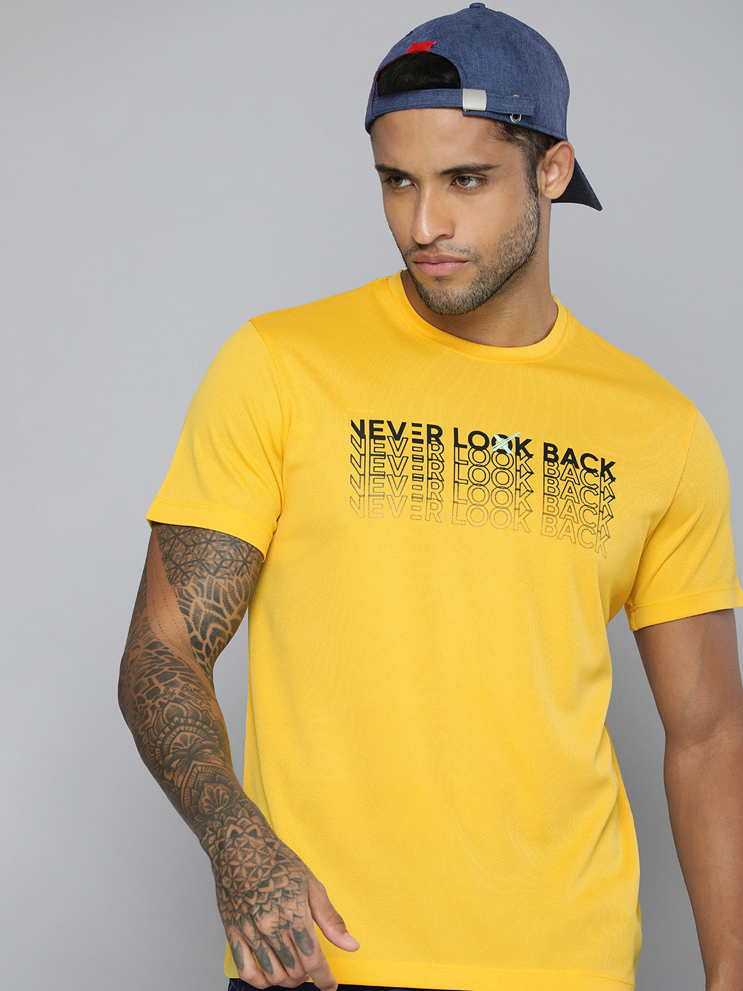 

HRX by Hrithik Roshan Men Yellow & Black Typography Printed T-shirt