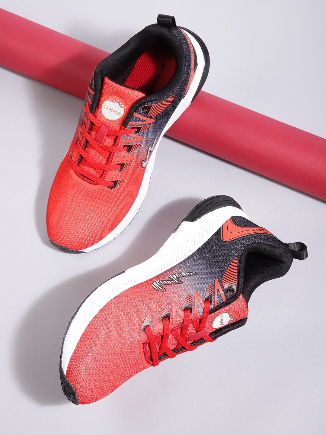 

Campus Men Red & Navy Blue Ombre Dyed Woven Design Running Shoes