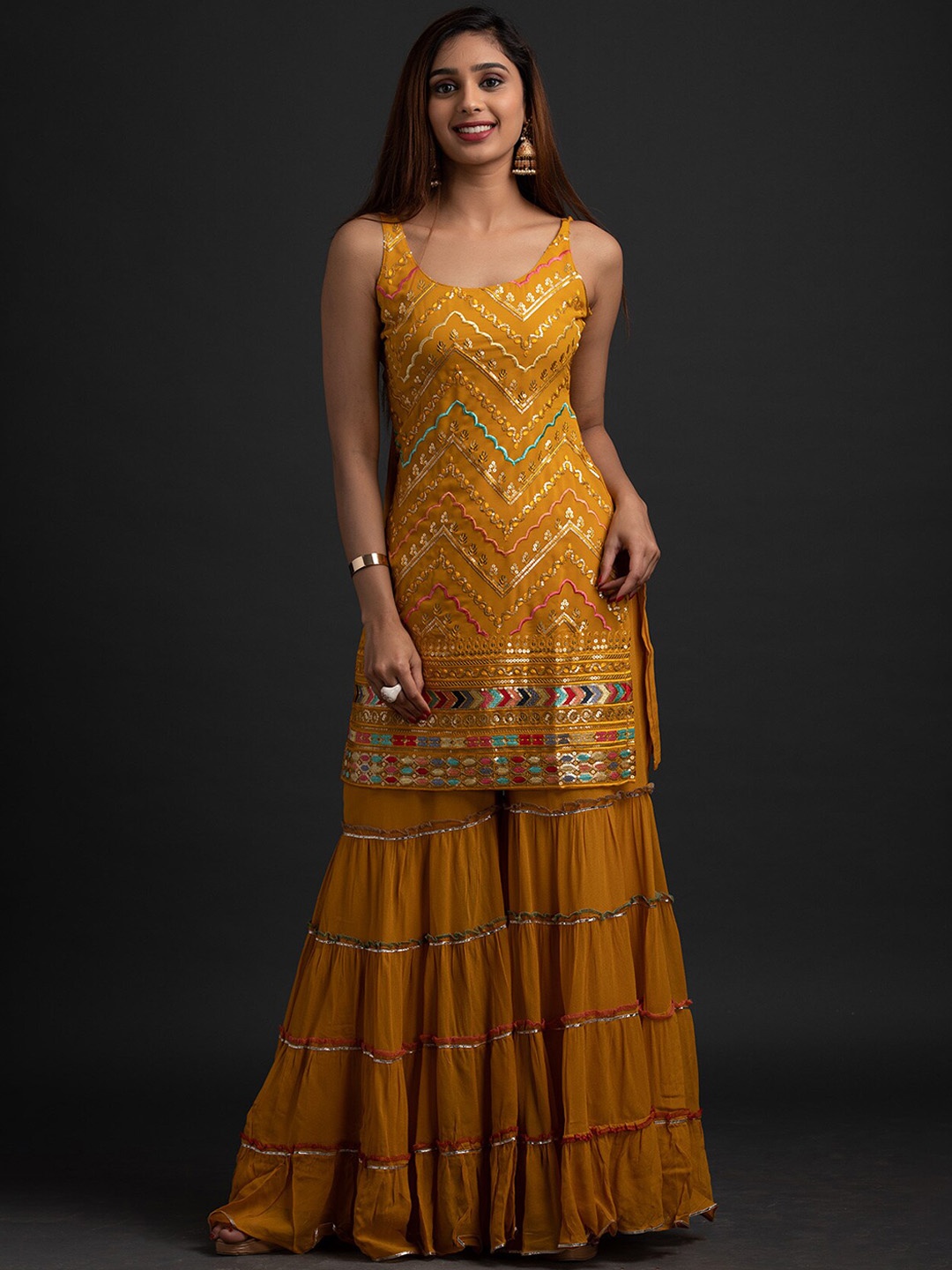 

Koskii Women Mustard Yellow Ethnic Motifs Embroidered Sequinned Kurta with Sharara