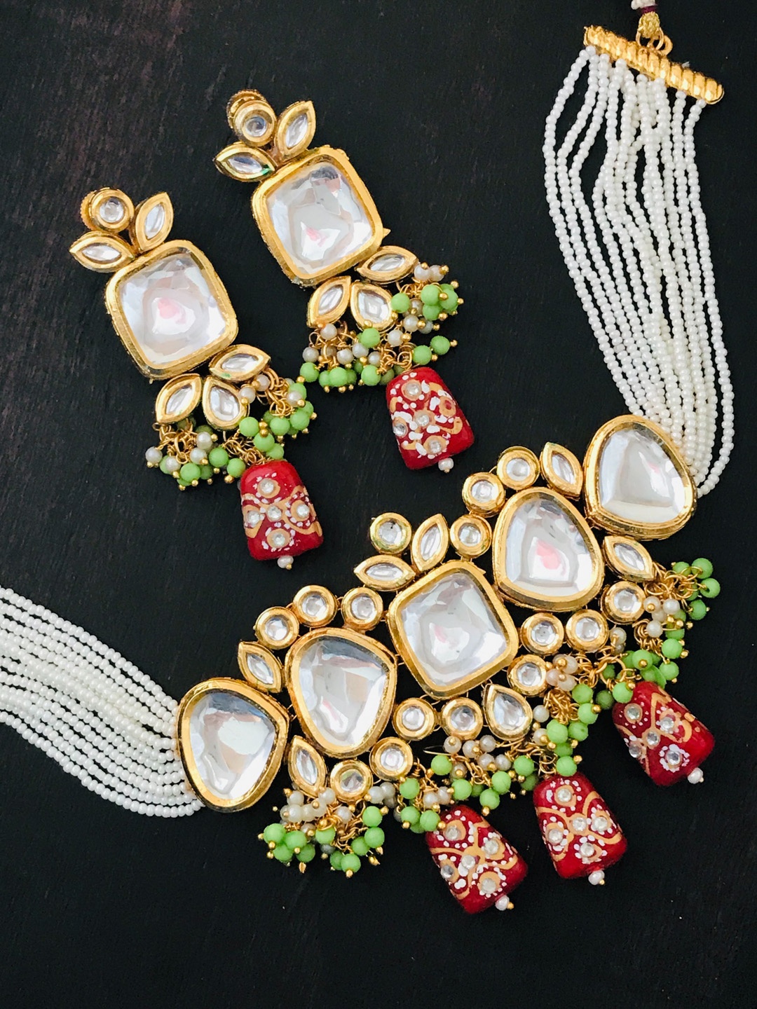 

The Opal Factory Gold-Plated Red & White Kundan Studded & Beaded Jadau Jewellery Set