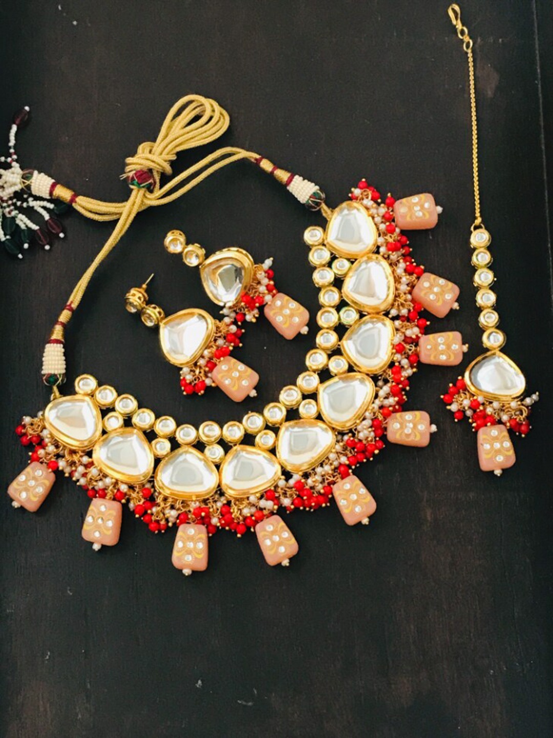 

The Opal Factory Gold-Plated Peach Coloured & White Kundan Studded & Beaded Jadau Jewellery Set