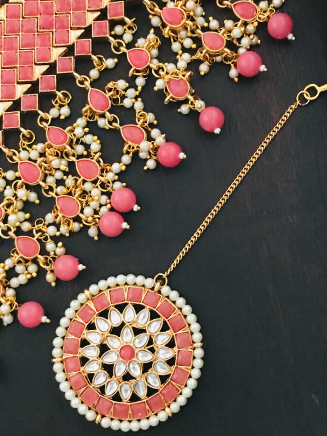 

The Opal Factory Gold-Plated Peach Coloured & White Kundan Studded & Beaded Jadau Jewellery Set