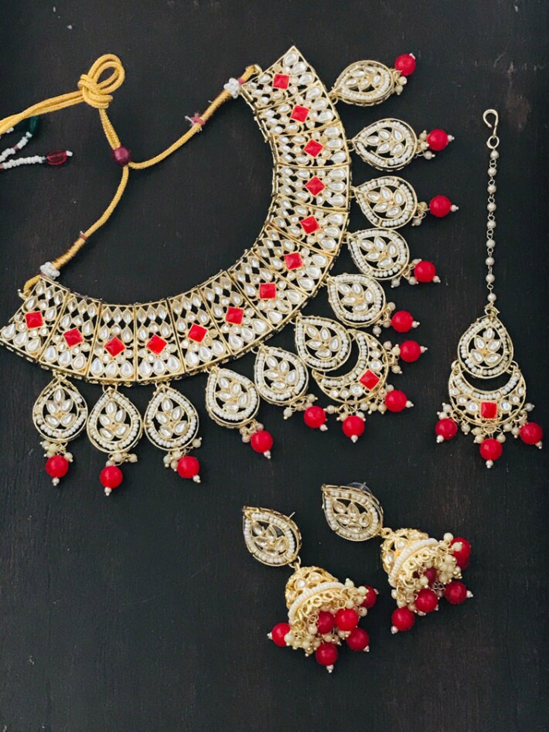 

The Opal Factory Gold-Plated Red & White Stone Studded & Beaded Jadau Jewellery Set