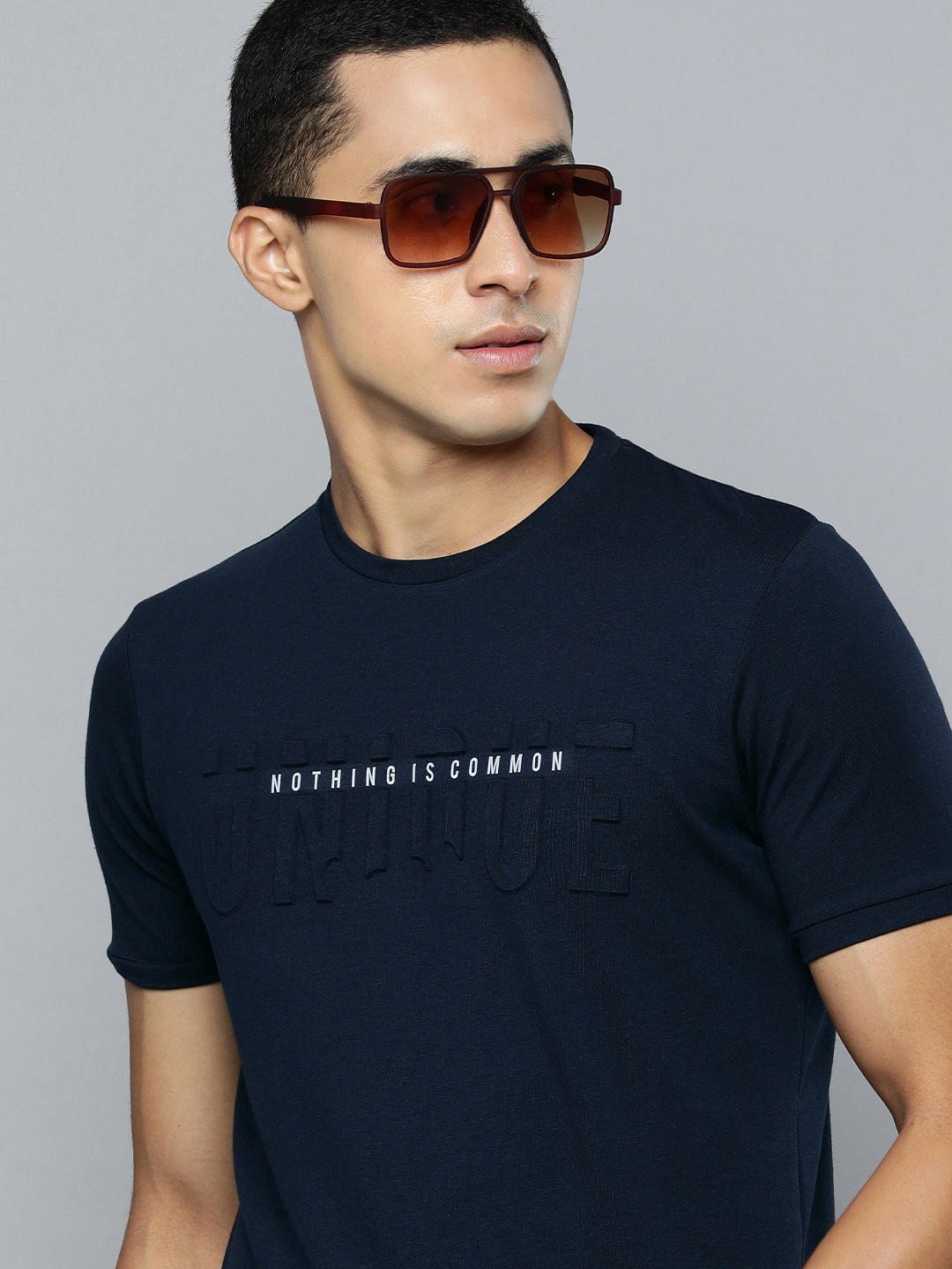 

Lawman pg3 Men Navy Blue & White Typography Printed Applique Slim Fit T-shirt
