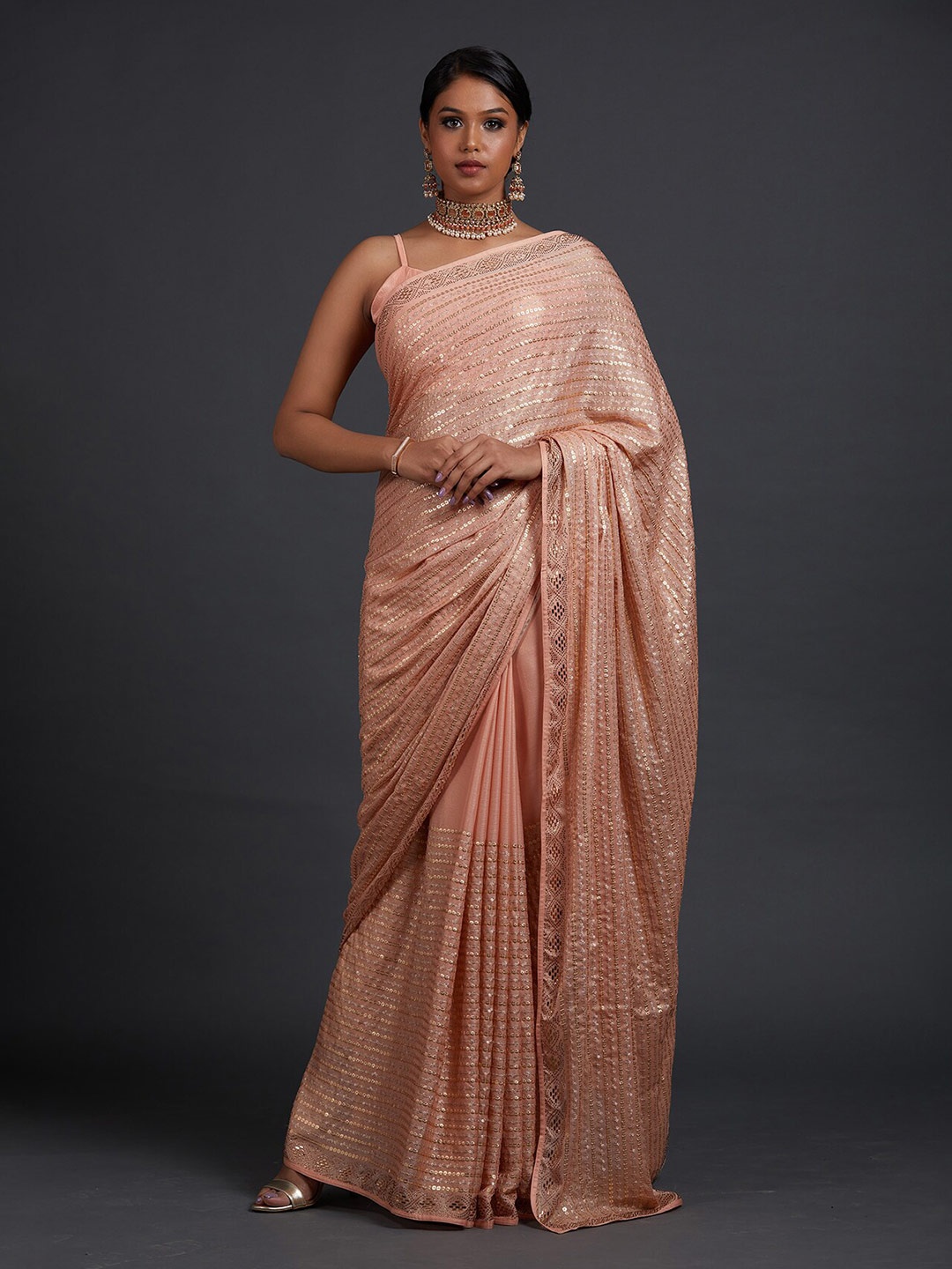 

Koskii Women Peach & Gold-Toned Embellished Sequinned Saree