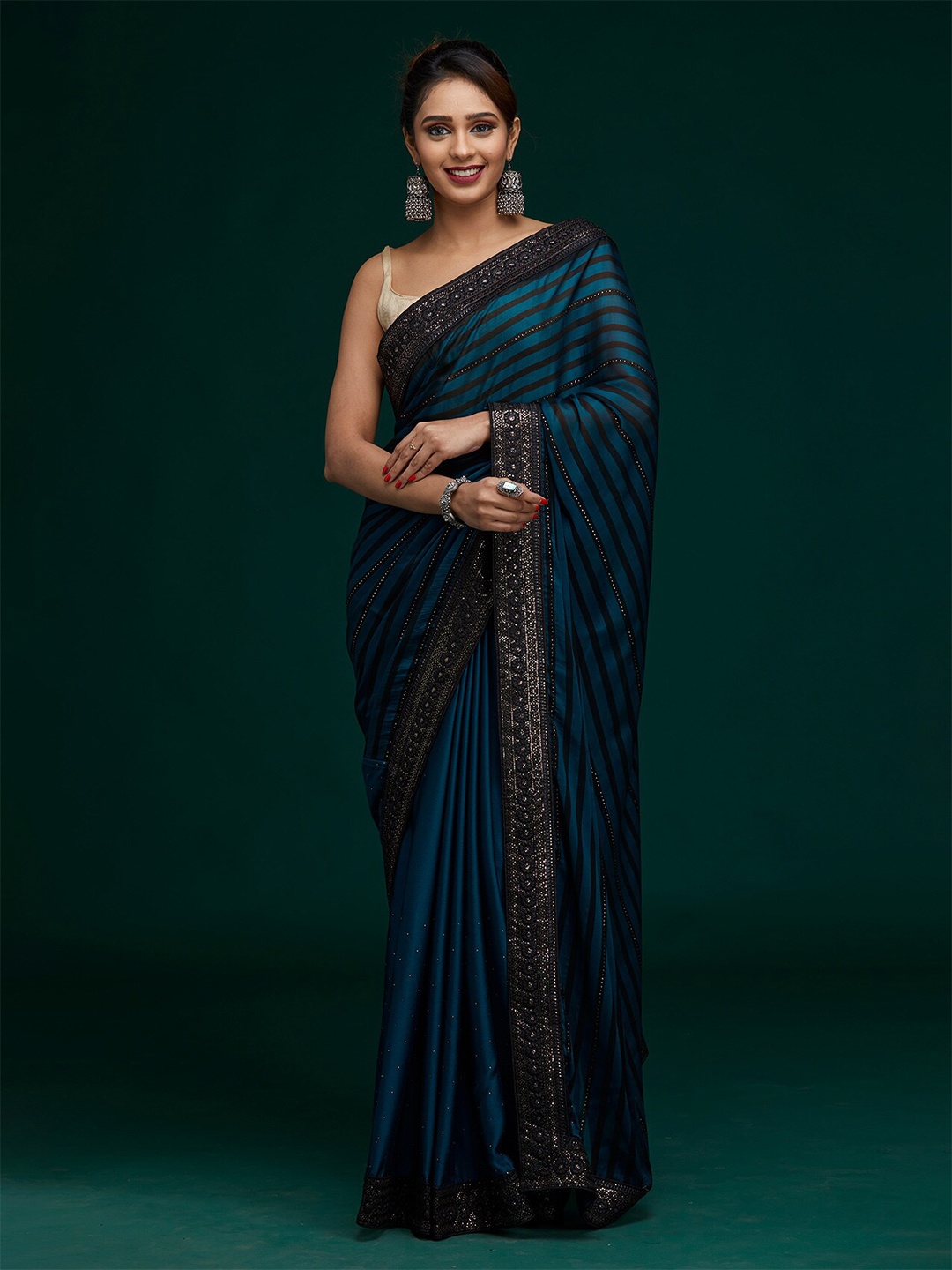 

Koskii Women Blue & Silver-Toned Striped Sequined Saree