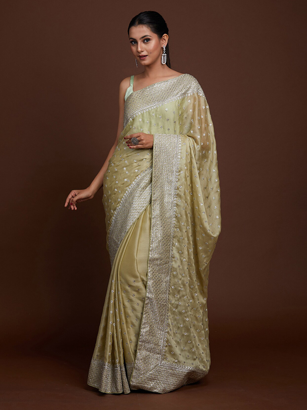 

Koskii Green & Silver-Toned Woven Design Zari Saree