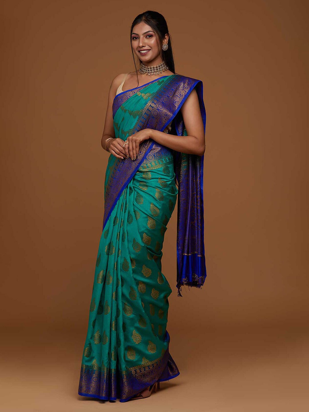 

Koskii Green & Blue Floral Zari Art Silk Saree