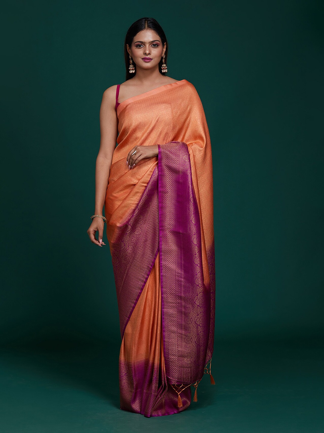 

Koskii Peach & Purple Woven Design Zari Brocade Banarasi Saree