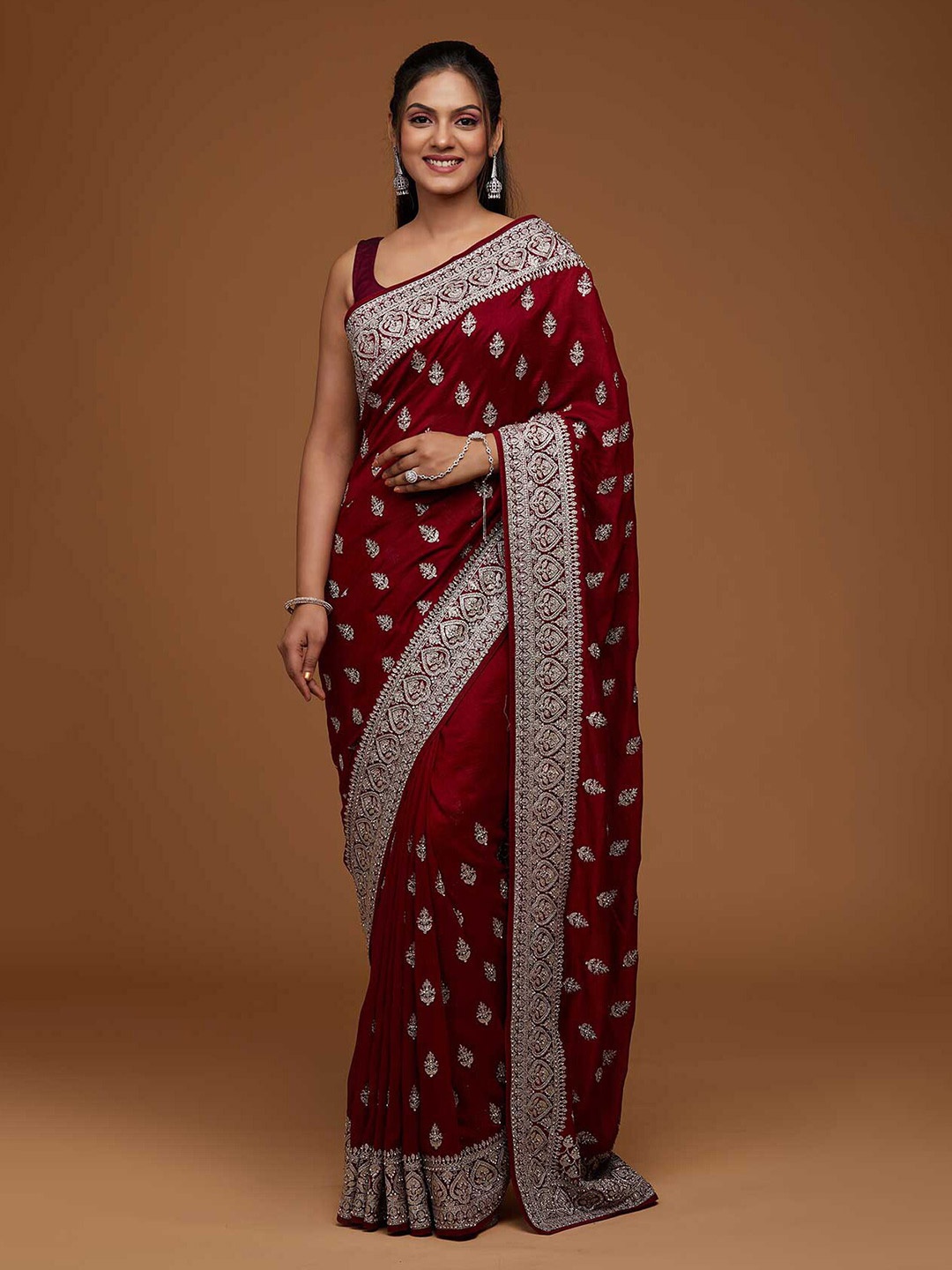 

Koskii Maroon & Gold-Toned Floral Embroidered Art Silk Saree