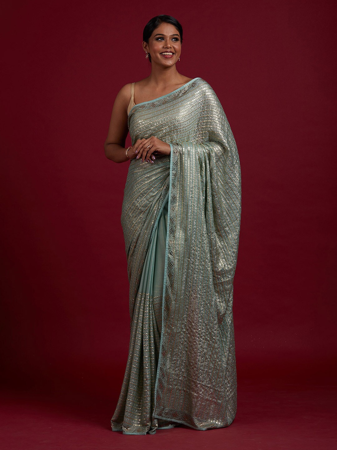 

Koskii Green & Gold-Toned Striped Sequinned Saree