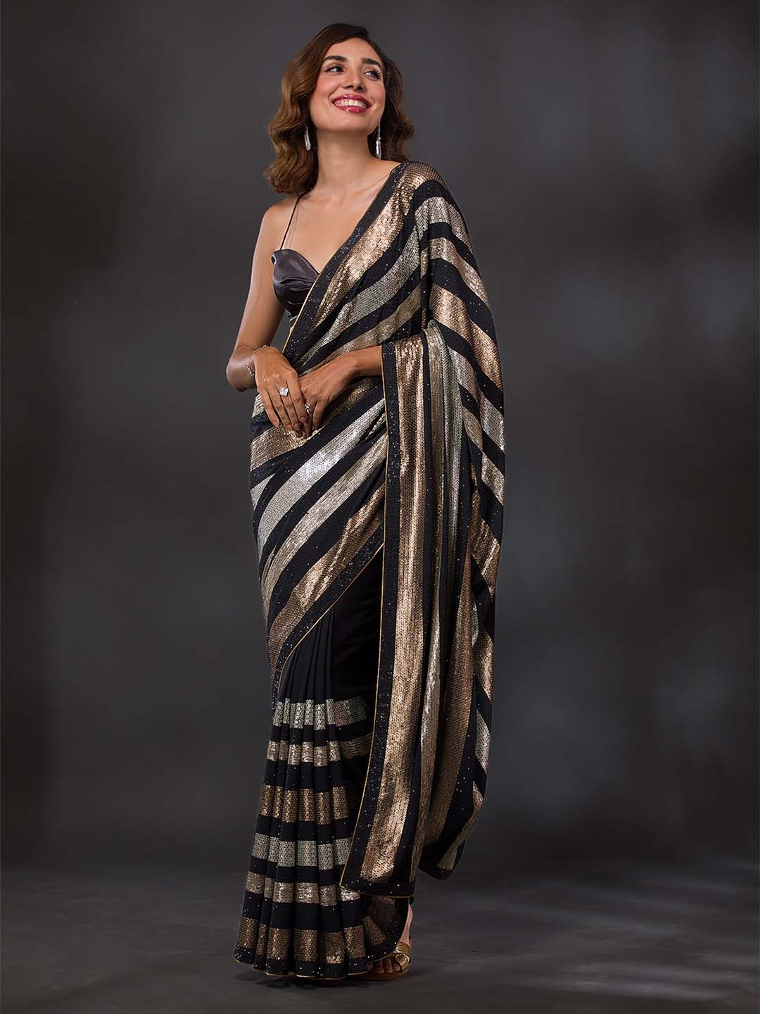 

Koskii Black & Gold-Toned Embellished Sequinned Georgette Saree