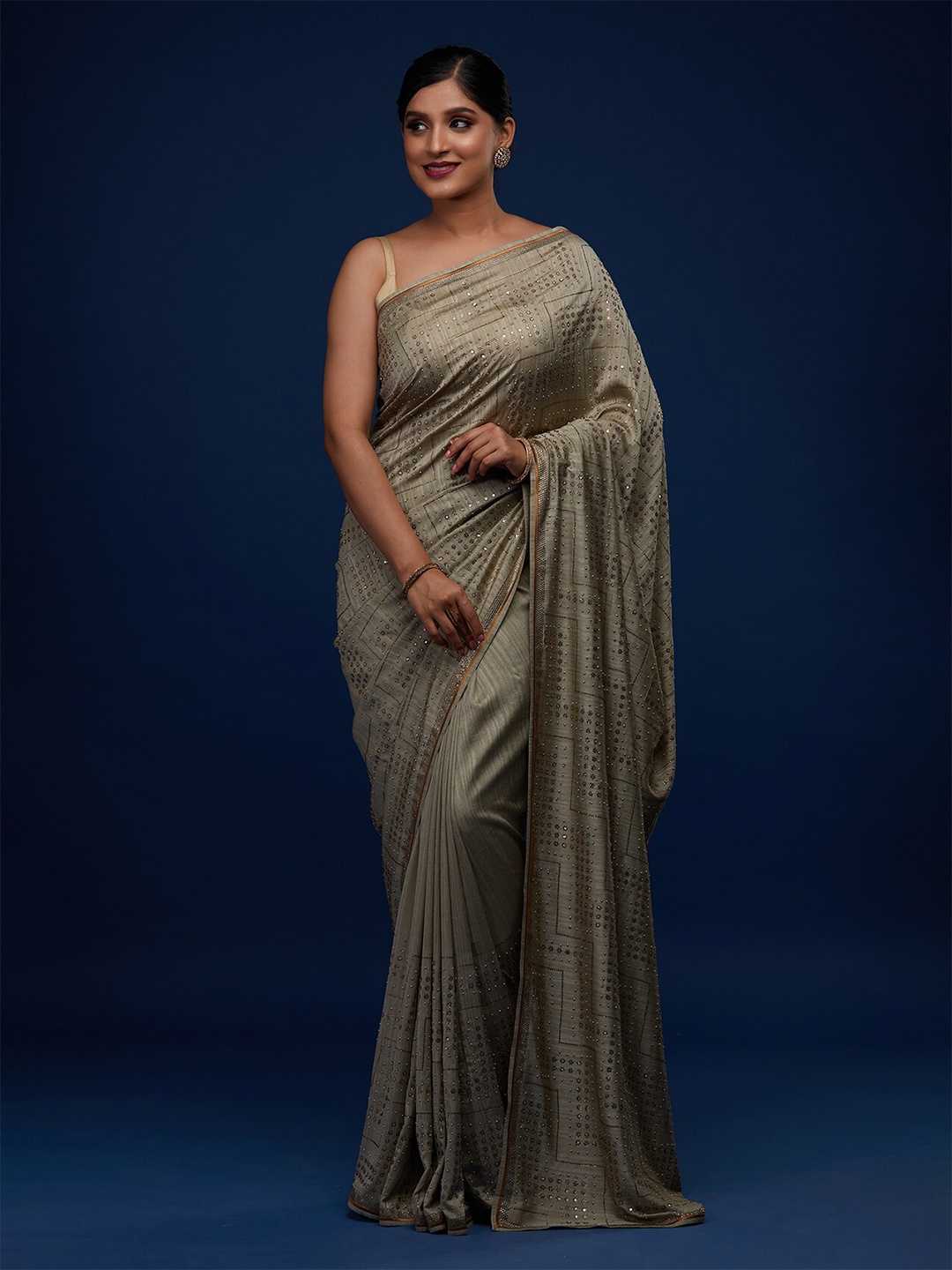 

Koskii Green & Silver-Toned Beads and Stones Embellished Saree