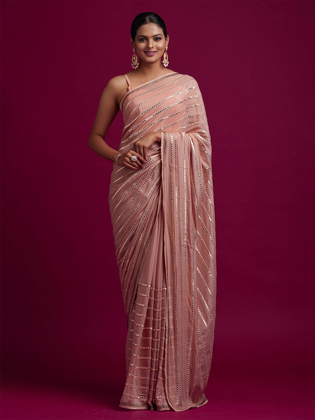 

Koskii Peach-Coloured & Gold-Toned Striped Sequinned Saree