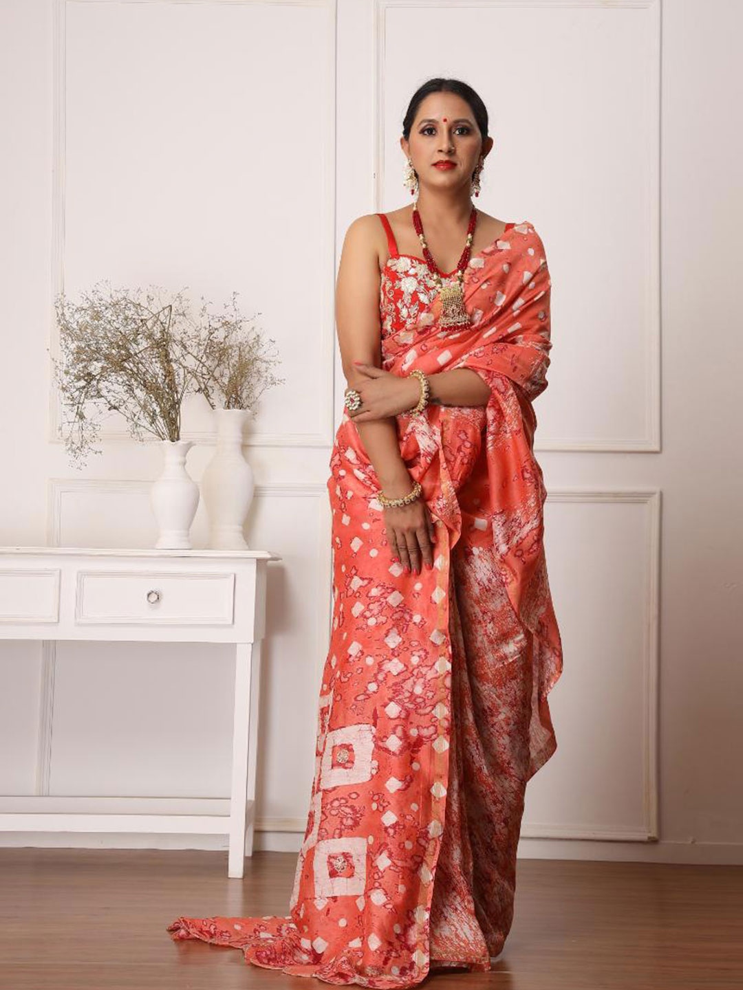 

Baisacrafts Women Orange & White Gotta Patti Art Silk Batik Block Print Saree