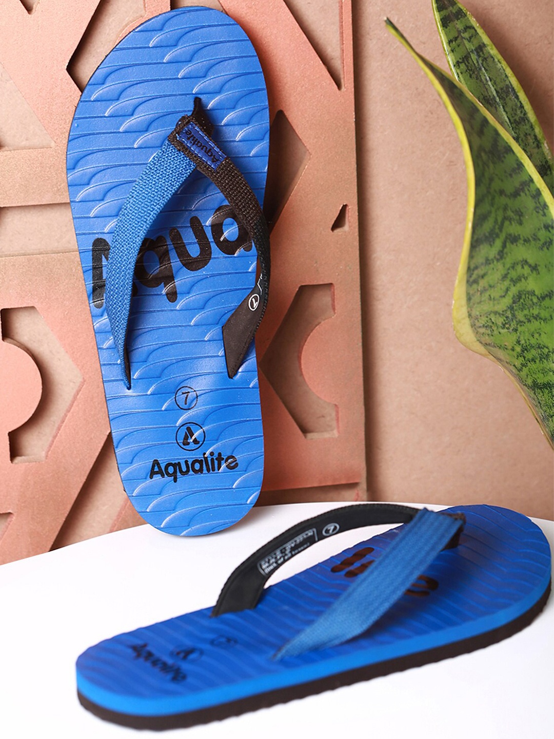 

Aqualite Men Blue & Black Printed Rubber Thong Flip-Flops