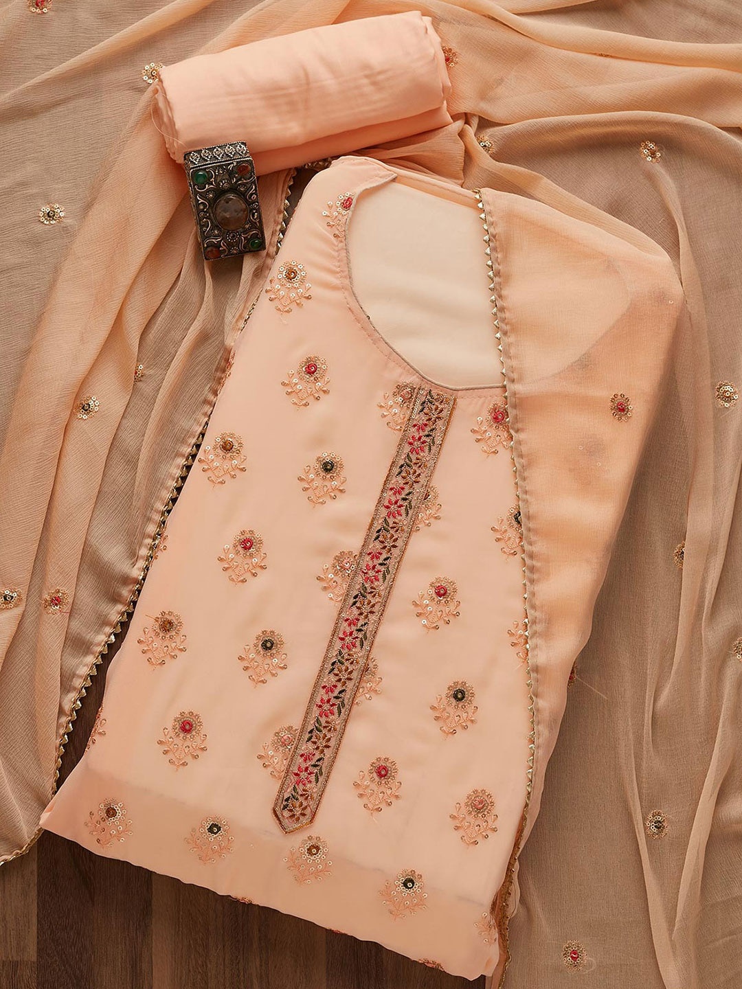 

Koskii Peach-Coloured & Red Embellished Unstitched Dress Material