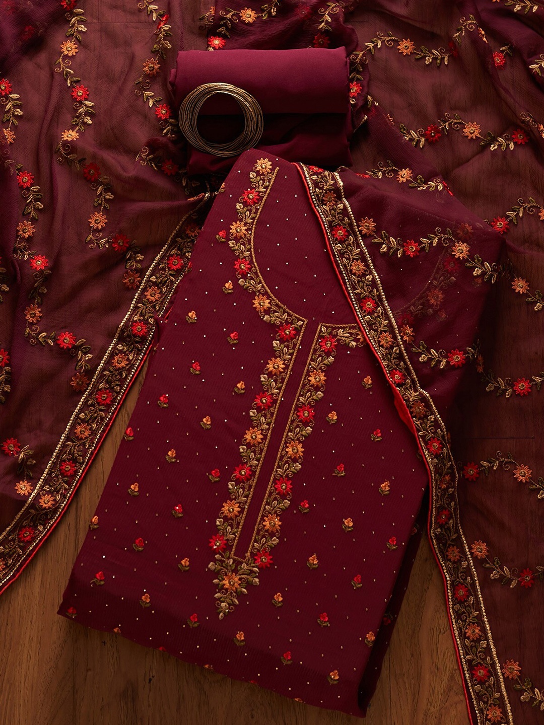 

Koskii Women Maroon & Orange Embroidered Unstitched Dress Material