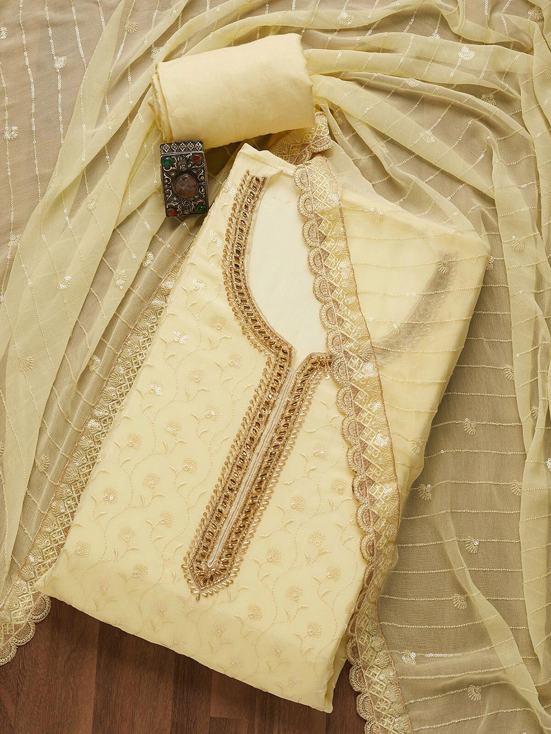 

Koskii Women Yellow & Gold Embroidered Unstitched Dress Material