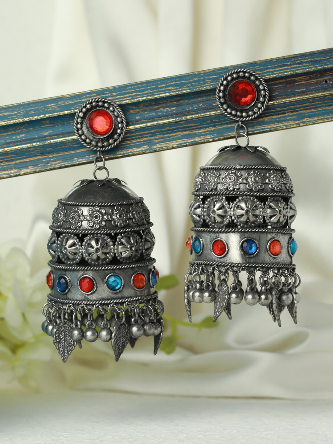 

Jazz and Sizzle Silver-Toned Dome Shaped Jhumkas Earrings