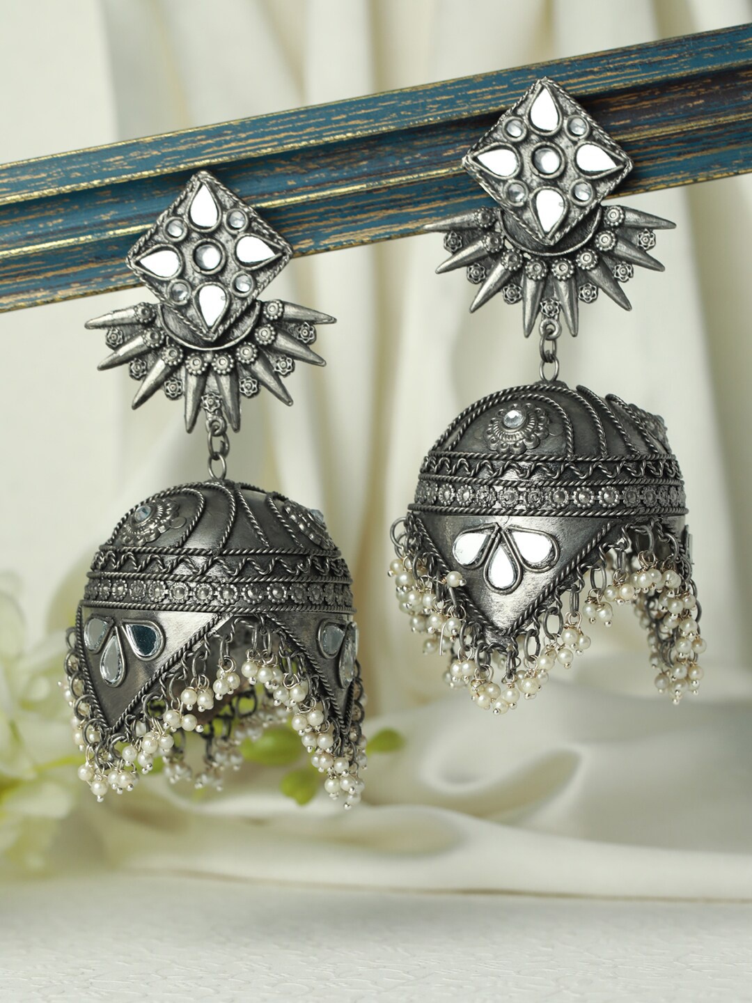 

Jazz and Sizzle Silver-Toned Dome Shaped Jhumkas Earrings