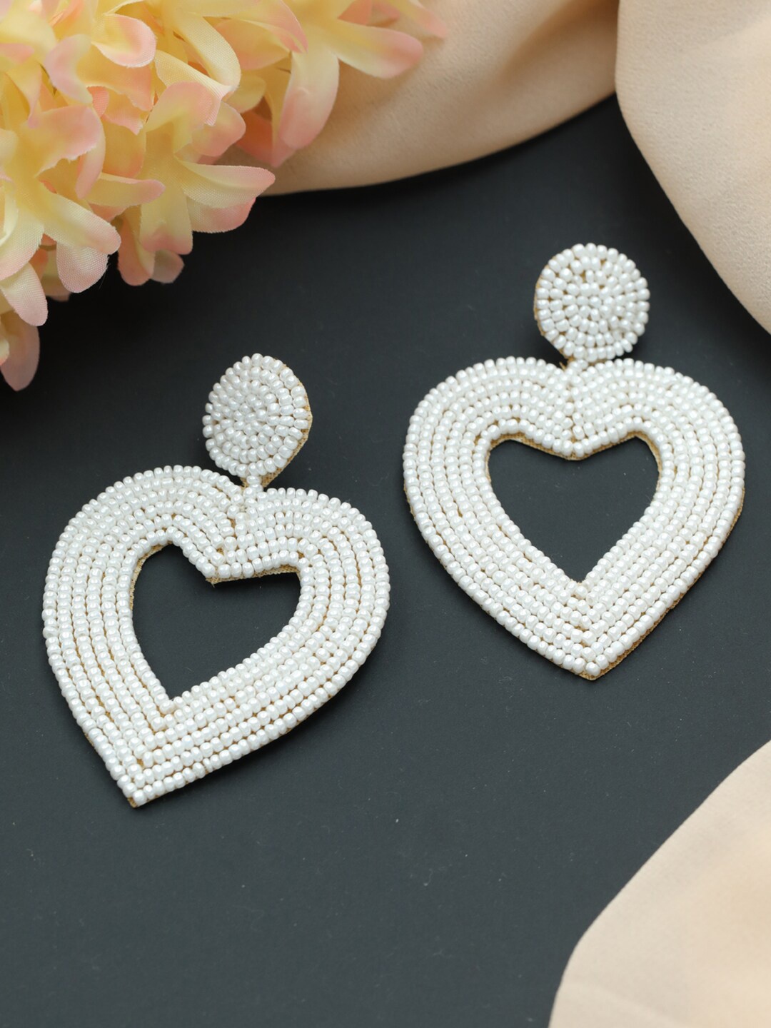 

Jazz and Sizzle White Heart Shaped Drop Earrings