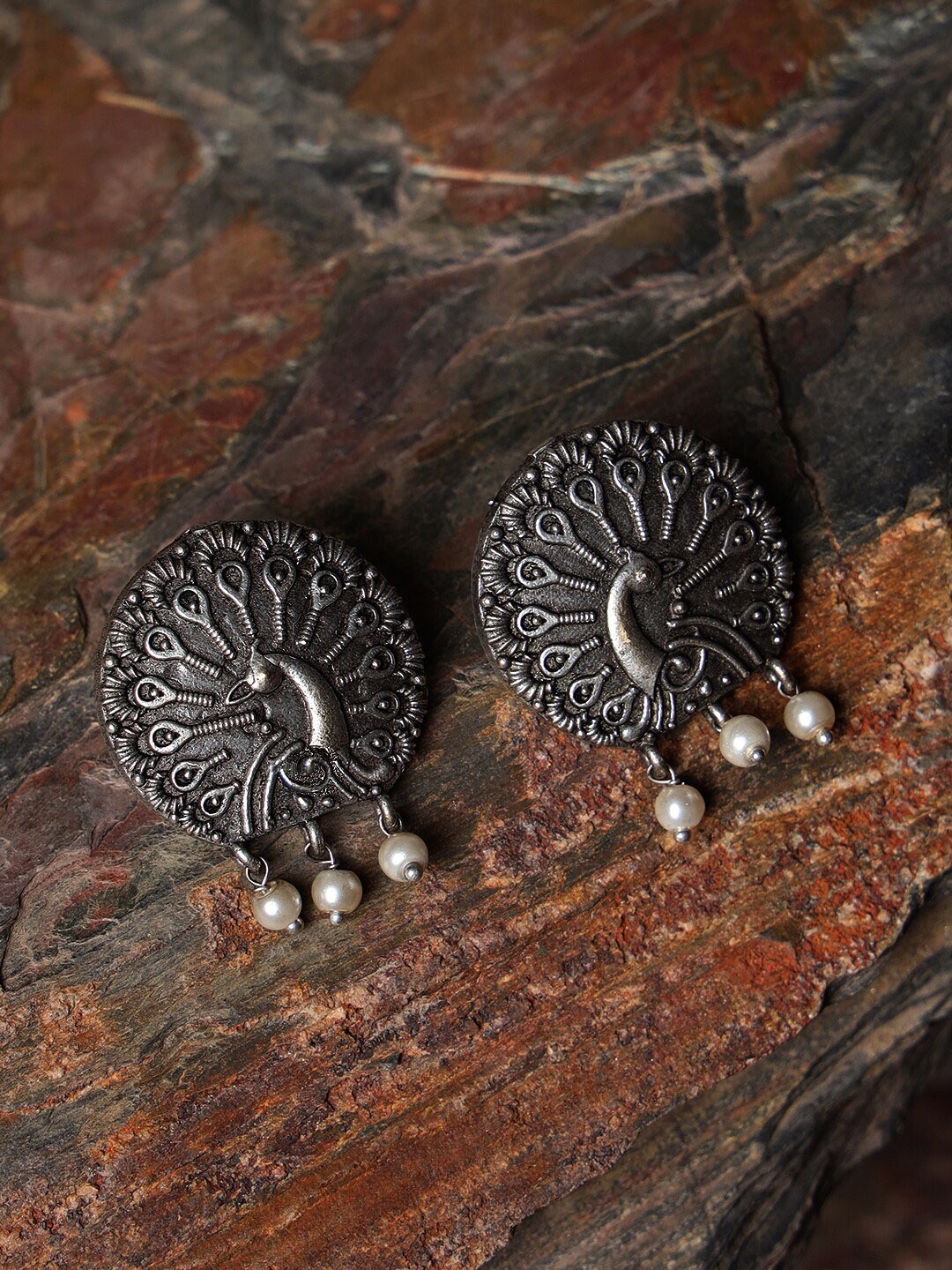 

Jazz and Sizzle Silver-Toned Peacock Shaped Jhumkas Earrings