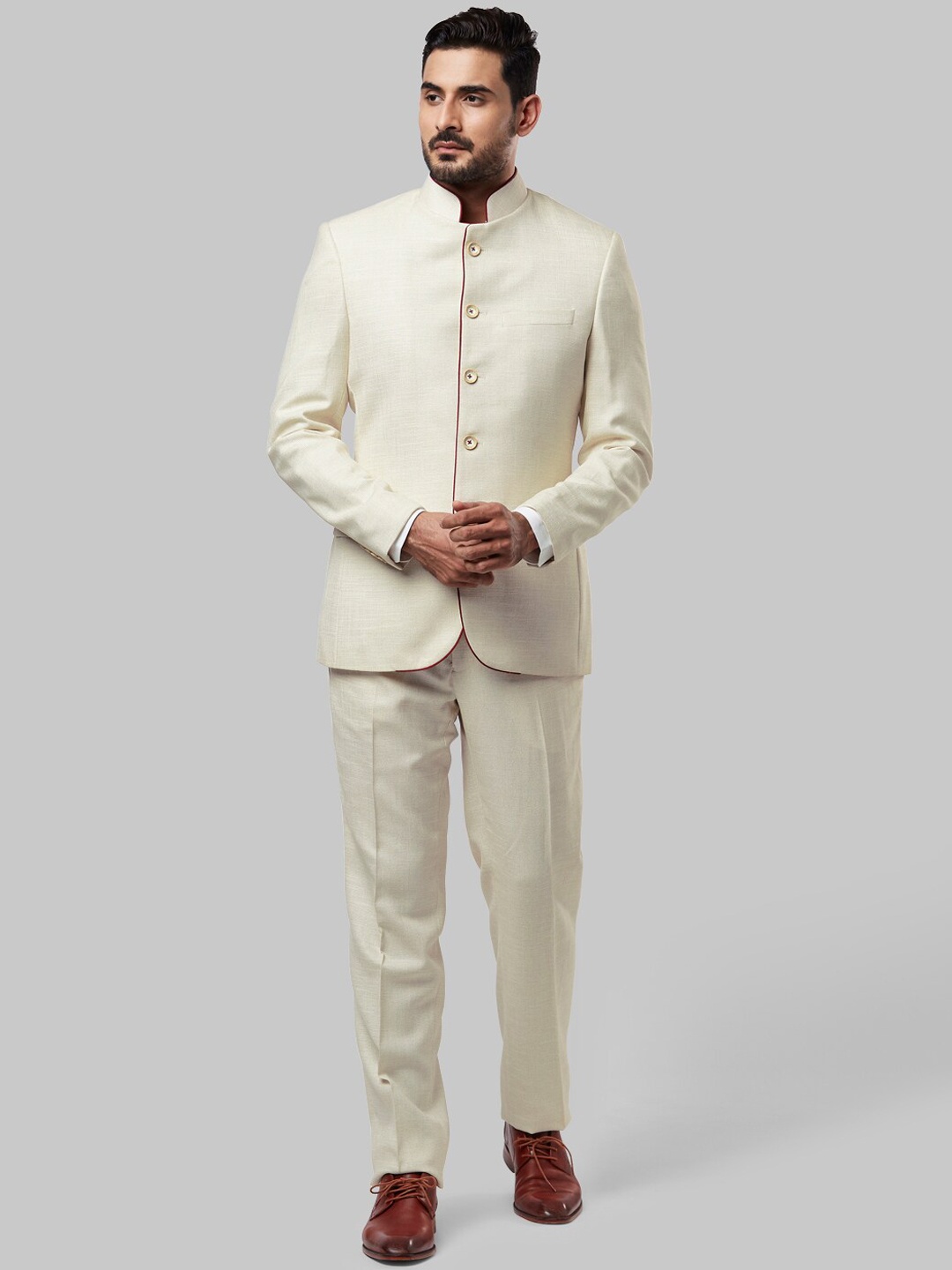 

Raymond Men Beige Colored Solid Two Piece Suit